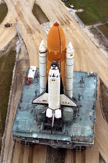 In preparation for Space Shuttle Mission STS-87, Columbia rolls out to Launch Complex 39B atop the crawler-transporter ca. 1997