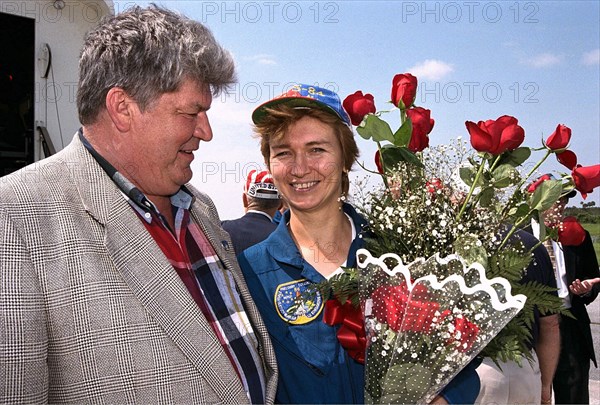 Veteran cosmonaut Valery Ryumin greets his wife, STS-84 Mission Specialist Elena V. Kondakova ca. 1997