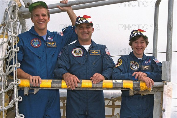 STS-86 Mission Specialists Scott Parazynski, at left, David Wolf, and Wendy Lawrence, at right, participate in emergency egress training at Launch Pad 39A as part of Terminal Countdown Demonstration Test (TCDT) activities ca. 1997