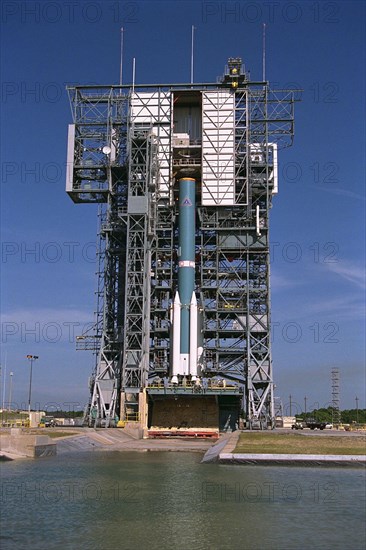 The solid rocket motors of the Delta II rocket which will to be used to launch the Advanced Composition Explorer (ACE) spacecraft are erected at Launch Complex 17A at Cape Canaveral Air Station ca. 1997