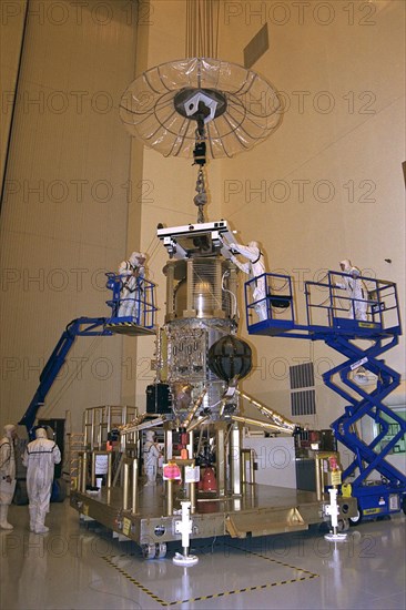The propulsion system is mated to the Lower Equipment Module of the Cassini spacecraft in the Payload Hazardous Servicing Facility (PHSF) ca. 1997