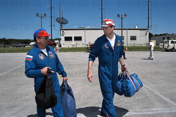 STS-86 Commander James D. Wetherbee, at right, and Mission Specialist Vladimir Georgievich Titov prepare to leave from KSC’s Shuttle Landing Facility ca. 1997