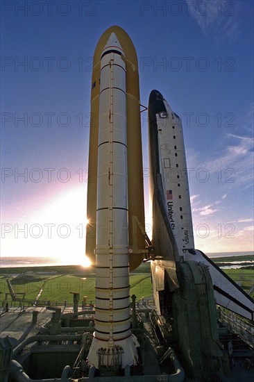 Atop the crawler/transporter, the Space Shuttle orbiter Atlantis rolls out to Launch Complex 39A in preparation for mission STS-86 ca. 1997