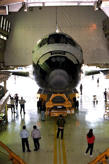 The orbiter Atlantis rolls out of the Orbiter Processing Facility at Kennedy Space Center (KSC) for its journey to the Shuttle Landing Facility ca. 1997