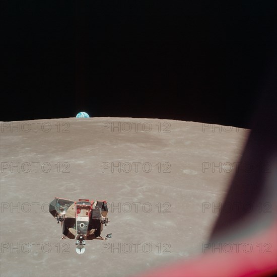 (21 July 1969) --- The Apollo 11 Lunar Module (LM) ascent stage, with astronauts Neil A. Armstrong and Edwin E. Aldrin Jr. onboard, is photographed from the Command and Services Modules (CSM) in lunar orbit.