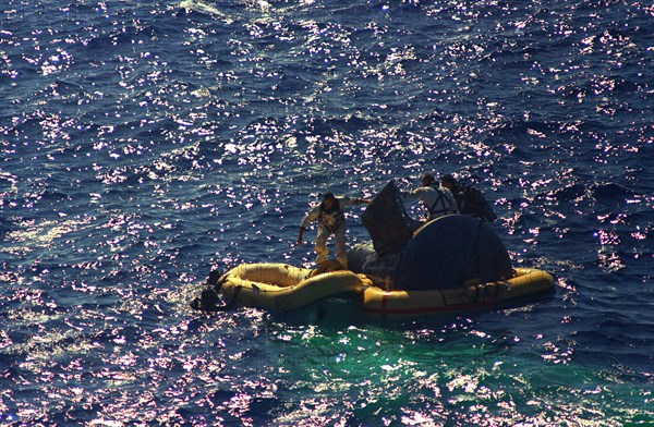 (29 Aug. 1965) - Astronauts L. Gordon Cooper Jr. and Charles Conrad Jr. exit their spacecraft after splashdown of the Gemini-5 spacecraft