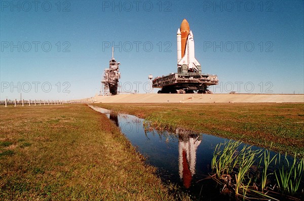 1995 - A massive 19 million pounds-plus (8.6 million kilograms) of Space Shuttle, support and transport hardware inch toward Launch Pad 39A from the Vehicle Assembly Building.