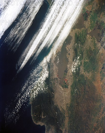 (28 April-6 May 1991) --- Large format (five-inch) frame of the San Francisco/Oakland Bay Area of northern California. Stratus clouds at 35,000 feet and cumulus clouds at about 15,000 feet are seen over the Pacific Coast, obscuring the Golden Gate Bridge.