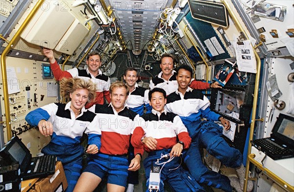 1992 - STS-47 crew poses for official onboard (in space) portrait in SLJ module