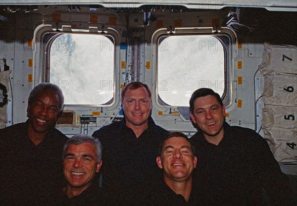 In orbit crew group portrait in the aft flight deck.