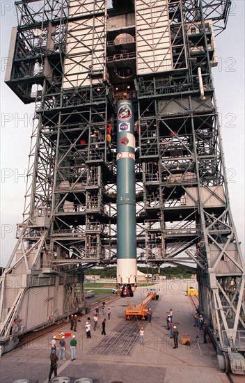 1998 - The first stage of Boeing's Delta 7326 rocket, which will be used to launch the Deep Space 1 spacecraft, is lifted into place above the surface of Pad 17A at Cape Canaveral Air Station.