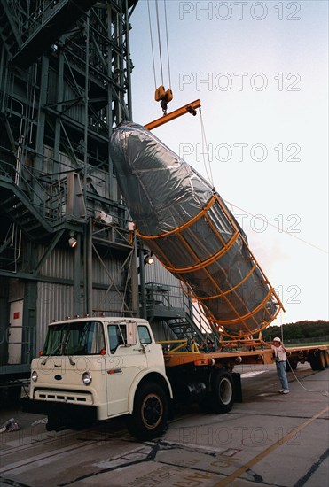 1998 - Arriving in the early morning hours at Pad 17A, Cape Canaveral Air Station, the fairing for Deep Space 1 is lifted from the truck before being raised to its place on the Boeing Delta 7326 rocket that will launch on Oct. 15, 1998.