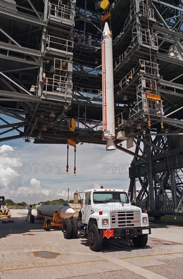 1998 - A booster is lifted off a truck for installation onto the Boeing Delta 7326 rocket that will launch Deep Space 1 at Launch Pad 17A, Cape Canaveral Air Station.