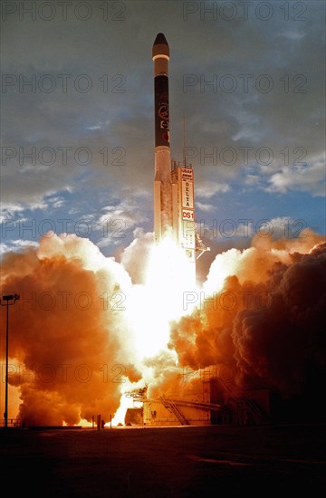 1998 - A Boeing Delta II (7326) rocket hurls Deep Space 1 through the morning clouds after liftoff, creating sun-challenging light with its exhaust, from Launch Complex 17A, Cape Canaveral Air Station.