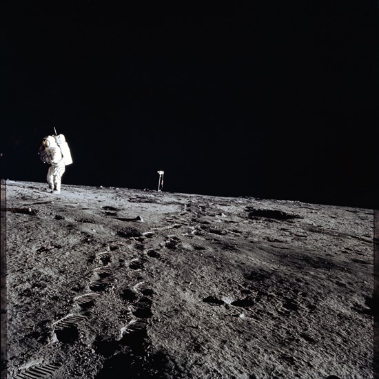 Apollo 12 Mission image - Photo of Al Bean and the TV taken from just inside the rim of Surveyor Crater