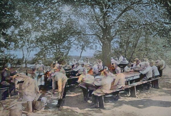 Orphans in Berlin having lunch in the garden