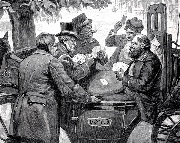 Men playing cards in a carriage