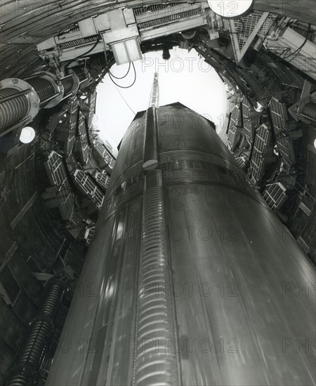 First stage of a Titan ICBM being lowered, 1963
