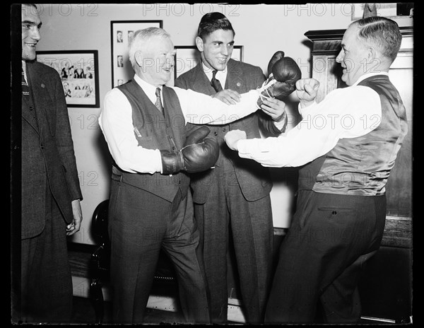 Franklin Roosevelt's Vice-President John Nance Garner playfully posing with boxing gloves. Washington, DC, March 25, 1936.