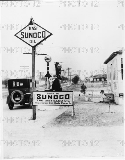 Filling Up At Sunoco Station