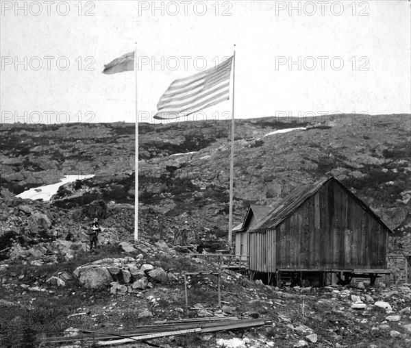 Alaska-Canada border with American and Canadian flags