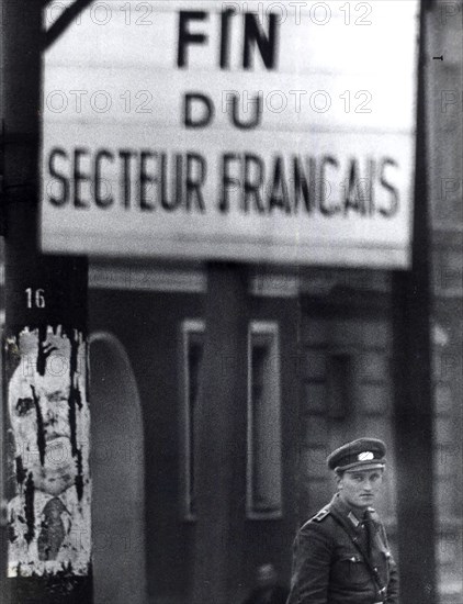 Officer Of East German Peoples Police Stands Guard At Control Point At Brunnenstarsse, A Workers District In East Berlin