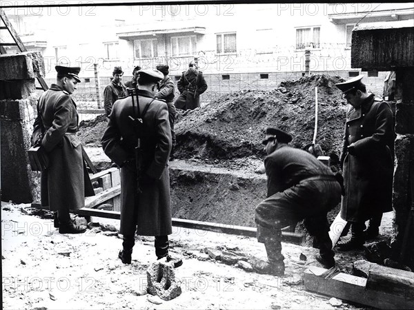Because of A Water Line Burst Directly Under The Wall a Troup of Volksarmy Workers Are Called In. The Construction Zone Was Guarded By Higher Level Soviet Officers