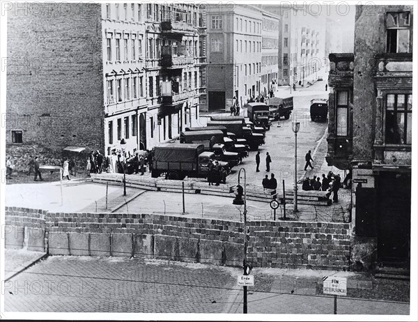 5/14/1961 - East German Army Trucks Line Up to Move Furniture Out of Houses Along Bernauer Strasse in Berlin