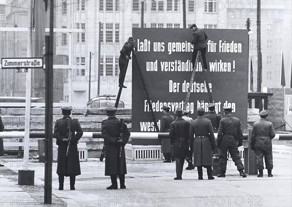 12/8/1961 - Friedrichstrasse. 'Understanding' is Lowercase in the Soviet Zone Regime. at The Vopos Border Crossing It Triggered A Debate, and After Some Time A Vopos Climbed Up The Ladder and Made With White Paint From The Small V Is A Big 'V'
