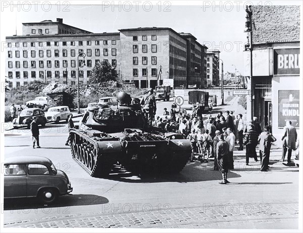 August 1961 - U.S. Tank and Riflemen Stand Guard at The Friedrichstrasse Crossing of the Divided City's Sector Border As West Berliners Look On