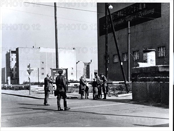 October 1962 - East Berlin Children Present Flowers to Vopos at Friedrichstrasse Crossing While Communists Photographers Take Propaganda Pictures