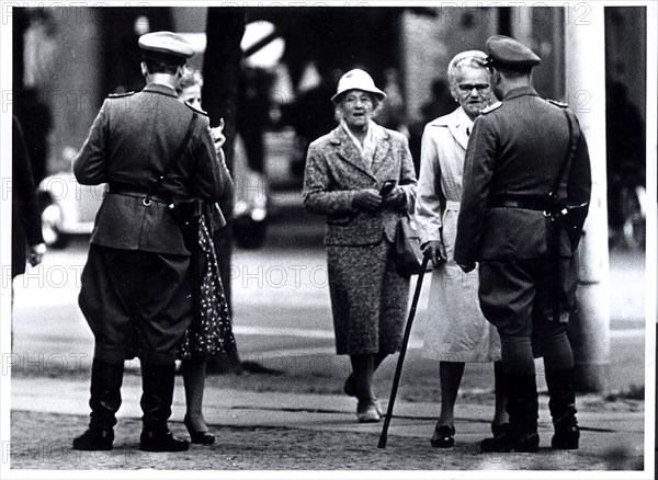 August 1961 - Two 'Vopos' (East German Police) Check East Berliners Seeking to Pass From Brandenburg Gate to Potsdamerplatz Along The Guarded Border of West Berlin