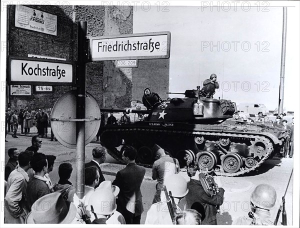 August 1961 - U.S. Tank and Riflemen Stand Guard at the Friedrichstrasse Crossing of the Divided City's Sector Border As West Berliners Look On