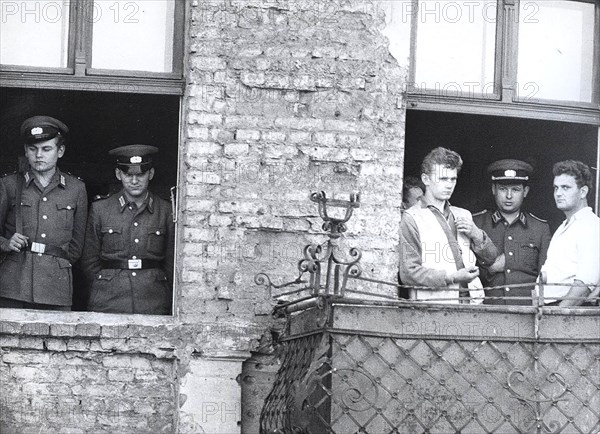 10/3/1961 - The Windows Up to the 4th Level of the Evacuated Houses at Bernauer Strasse Are Cemented Shut Under Supervision of the Volkspolizei