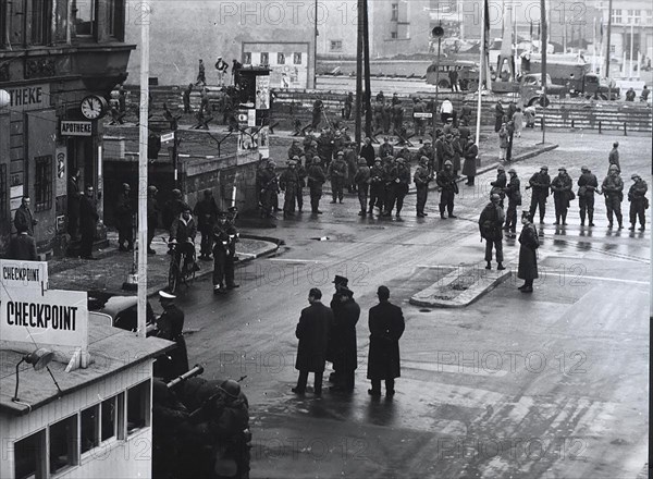 12/4/1961 - Behind a Thick Barrier of Military Equipped Volksarmy the Volkspolice and Construction Workers Erect a Tank Barrier at the Border Crossing 'Friedrichstrasse'