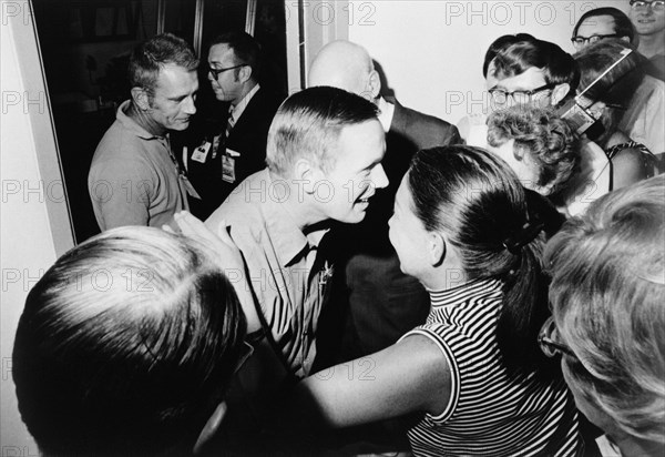 Astronaut Neil A. Armstrong (center)