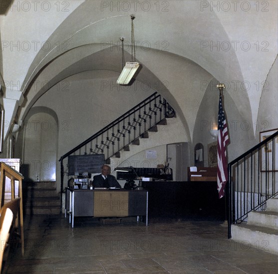 Worker sitting at desk inside Jerusalem U.S. annex office building