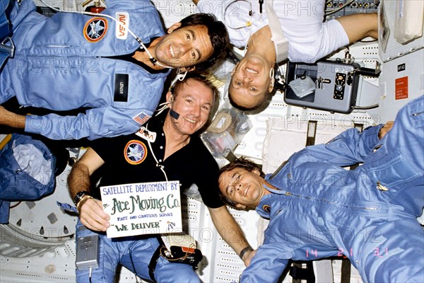 Four STS-5 astronaut crew members