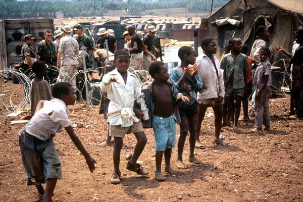 1994 - Children in Goma Zaire watch as supplies are unloaded.