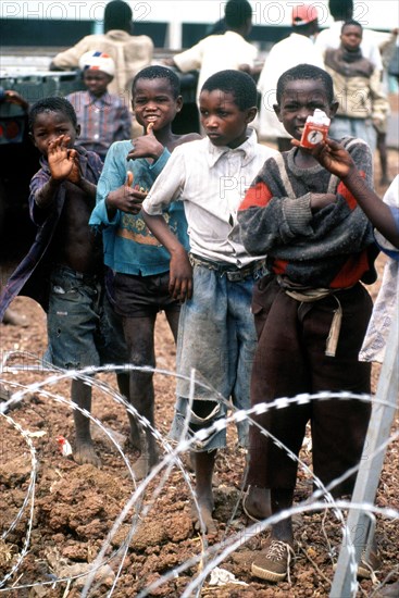 1994 - Children in Goma Zaire watch as supplies are unloaded.