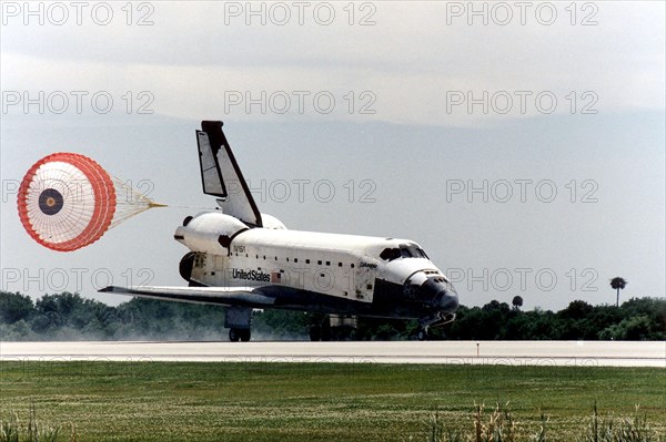 The Space Shuttle Columbia hurtles down Runway 33