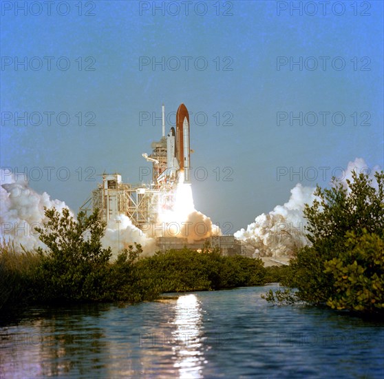 Space shuttle Columbia begins a new era of operational flights as it clears the launch tower