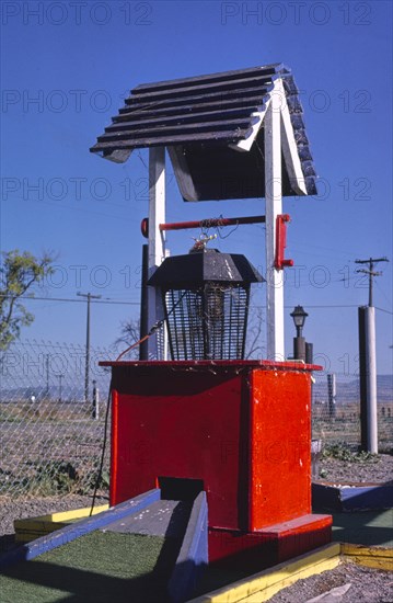 1980s America -  Fun Land mini golf, wishing well and bug zapper, Klamath Falls, Oregon 1987