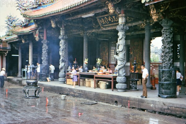 Some visitors and workers at Bangka Lungshan Temple in Taipei Taiwan ca. 1973