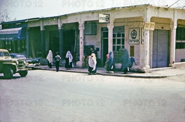 Arab women walking along the street in this Tiberias Israel street scene