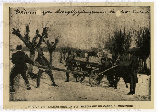 Italian prisoners forced to drag an ammunition wagon