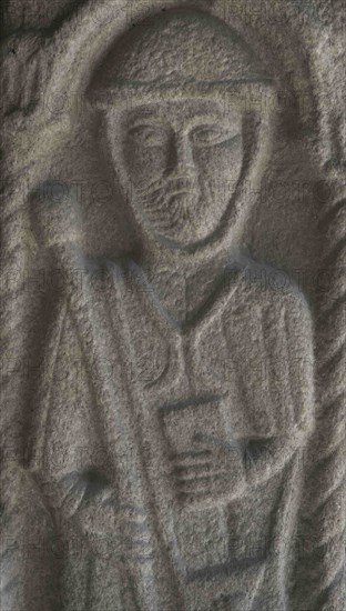 Bas-relief sculpture depicting a pilgrim