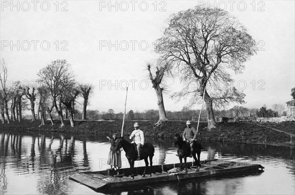 italy, pontine marshes, italian red cross ambulance, doctor on barge, 1920-30