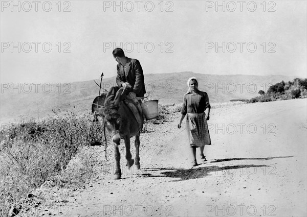 farmers on the street, alessandria del carretto, calabria, italy, 1963