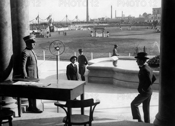 Lieutenant at the microphone during a horse show. 1929